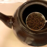 Placing tea in a Brown Betty teapot